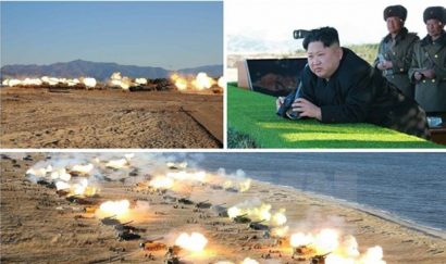 Nhà lãnh đạo Triều Tiên Kim Jong-ul (ảnh trên, góc phải) đã thị sát và chỉ đạo một cuộc tập trận pháo binh. (Nguồn: Yonhap/TTXVN)