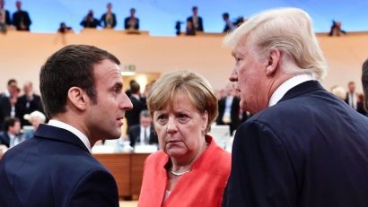 Từ trái qua phải: Tổng thống Pháp Macron, Thủ tướng Đức Merkel và Tổng thống Mỹ Trump (Ảnh: AFP)