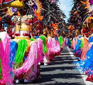 Street dancing parade of colorful mask and costume during the celebration of Masskara Festival at Bacolod City, Philippines; Shutterstock ID 471791120; Purchase Order: -