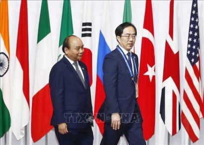 Lễ đón Thủ tướng Nguyễn Xuân Phúc dự Hội nghị G20. Ảnh TTXVN 